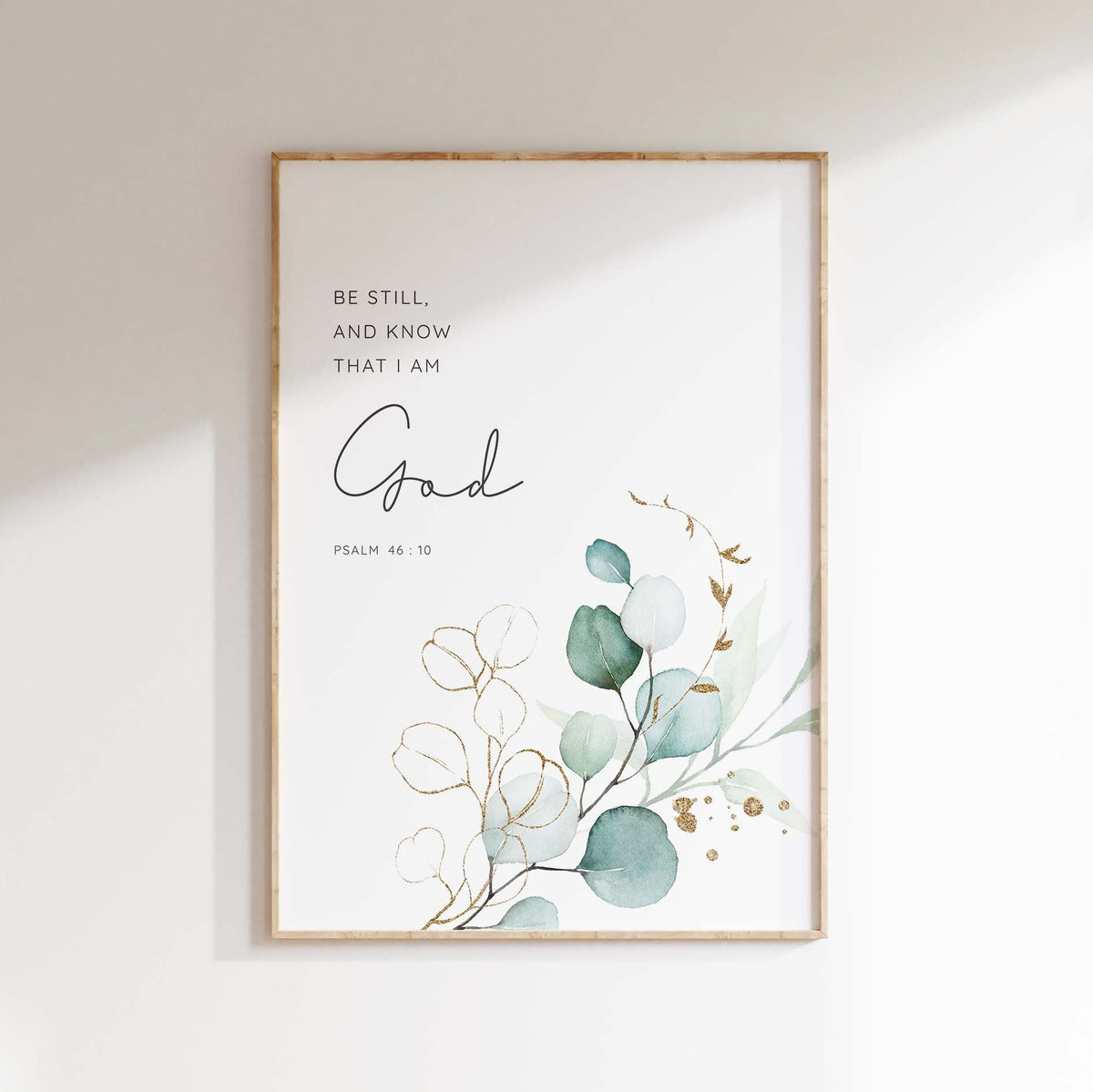 Psalm 46:10 - Be still and know Christian wall art with serene green botanical leaves, calming Bible verse faith decor.