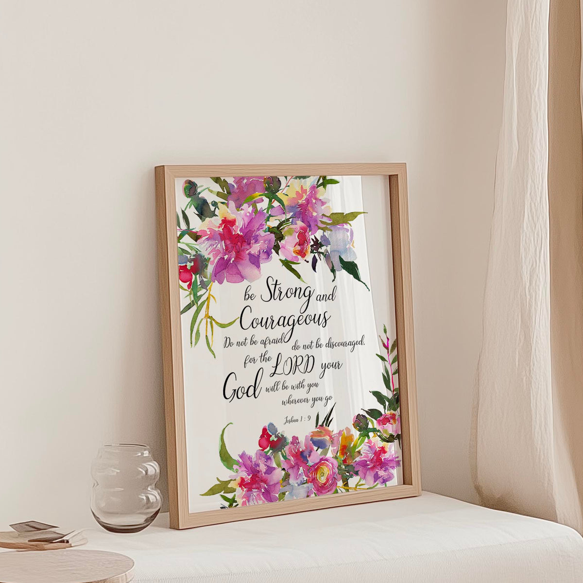 Joshua 1:9 - Be strong and courageous Christian wall art print with soft pink floral design, Bible verse wall decor.