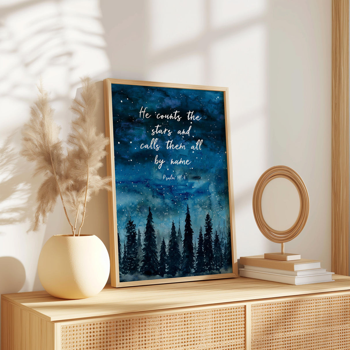 Christian wall art print featuring Psalm 147:4 with an indigo starry sky above a peaceful forest scene, inspired by the beauty of creation.
