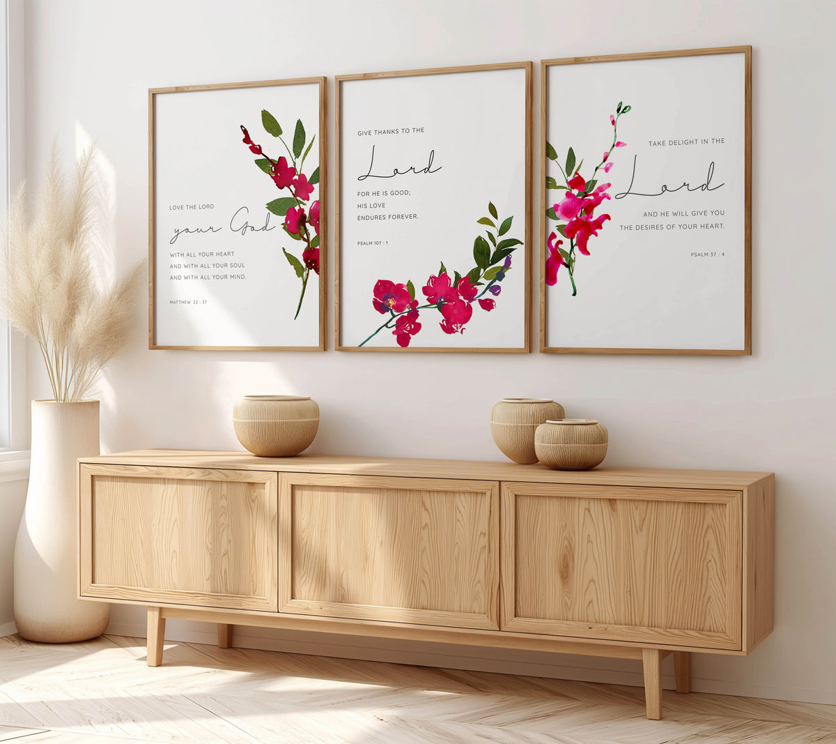 Psalm 107:1 - Christian Bible verse wall art with pink orchid floral design, elegant scripture print for faith filled home decor.