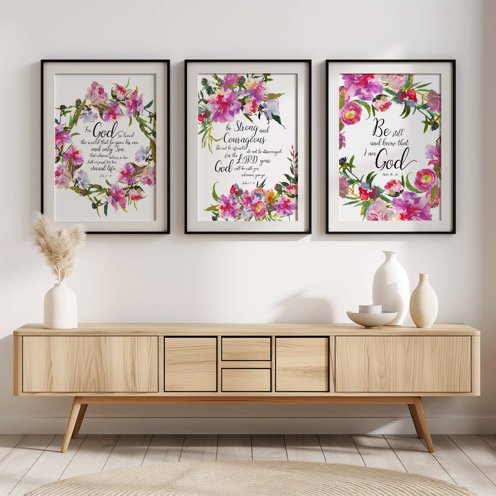 Floral Christian wall art print set of three featuring Bible verses from Psalm 46:10, John 3:16, and Joshua 1:9, surrounded by elegant floral designs.