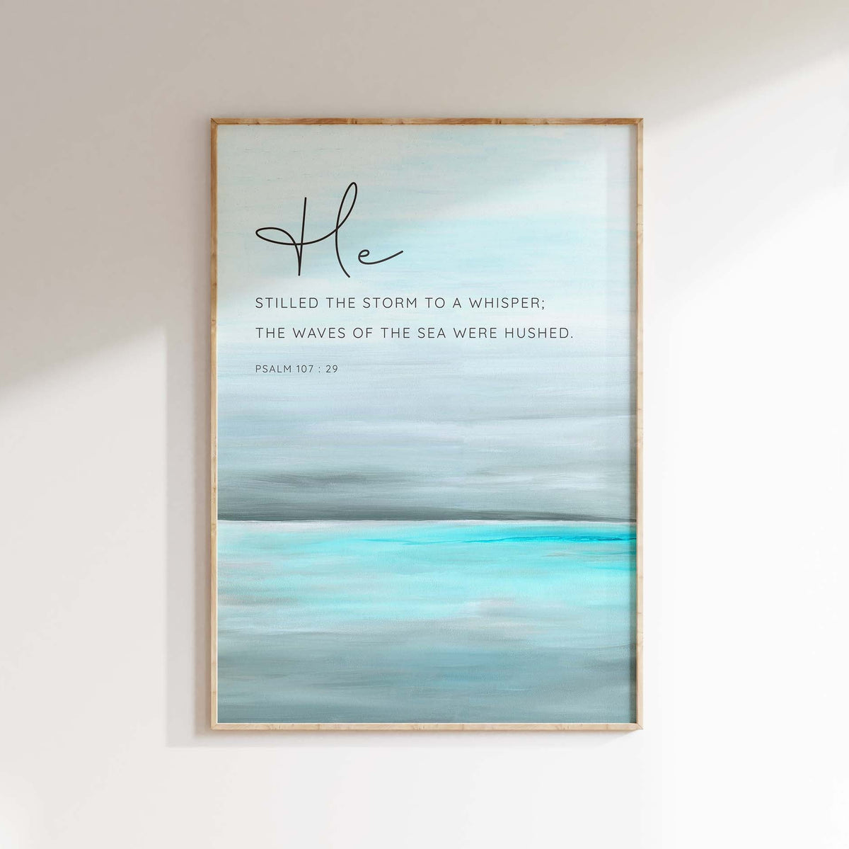 Psalm 107:29 - Bible quote art with abstract turquoise sea and He stilled the storm calm ocean scripture.