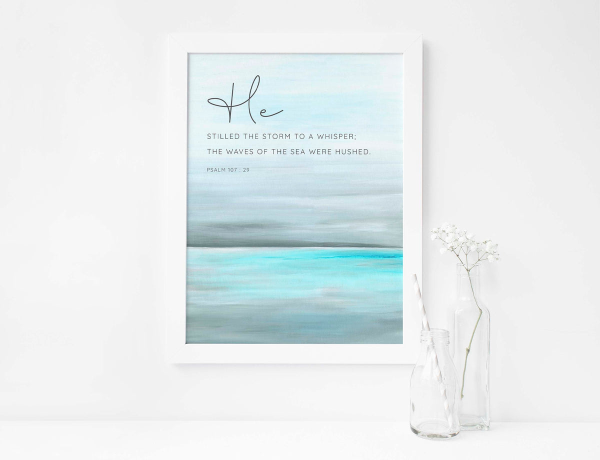Psalm 107:29 - Calm ocean bible verse art with contemporary seascape and stilled storm text.