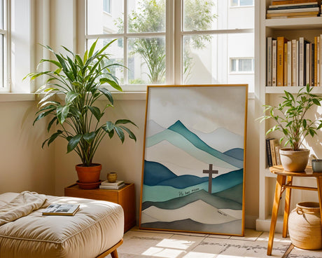 Matthew 28:6 - Easter Bible verse poster with simple brown cross, layered teal mountains and He Has Risen scripture.