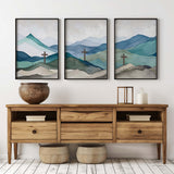Matthew 28:6, Isaiah 53:5, John 14:6 – Bible verse wall art set of three featuring crosses and serene mountain landscapes.