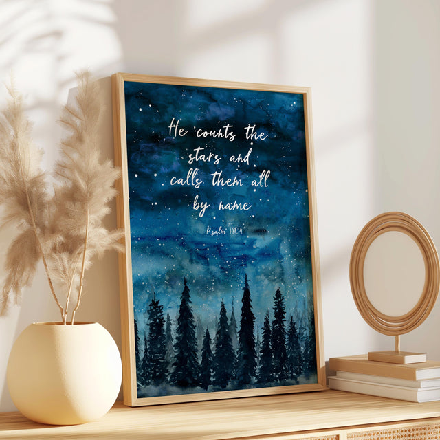 Christian wall art print featuring Psalm 147:4 with an indigo starry sky above a peaceful forest scene, inspired by the beauty of creation.