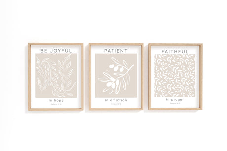 Romans 12:12 – Be joyful in hope Christian wall art 3 print set with neutral beige background and white botanical design.