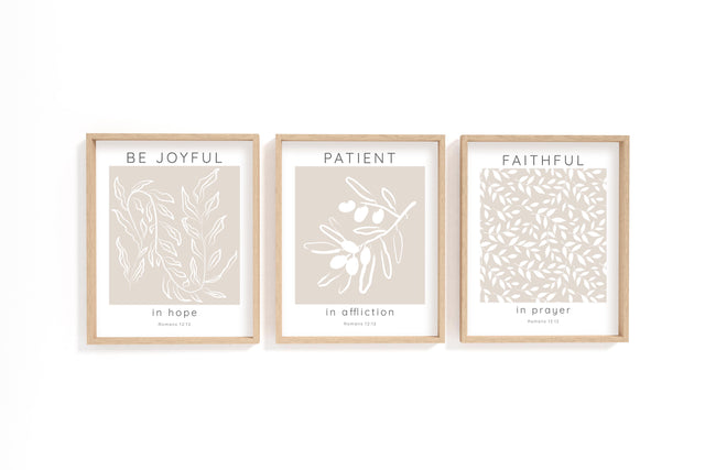 Romans 12:12 – Be joyful in hope Christian wall art 3 print set with neutral beige background and white botanical design.