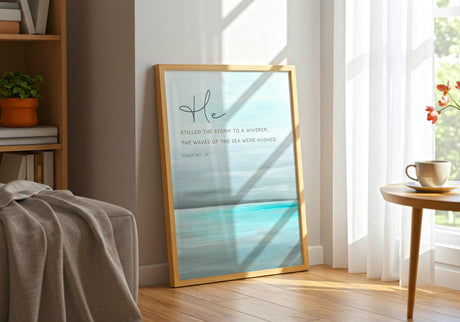Psalm 107:29 - Abstract seascape bible quote art with turquoise ocean, grey sky and He stilled the storm scripture for coastal decor.