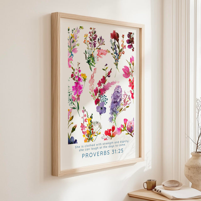 Proverbs 31:25 - She is clothed with strength and dignity Bible verse wall art, vibrant floral Christian home decor.