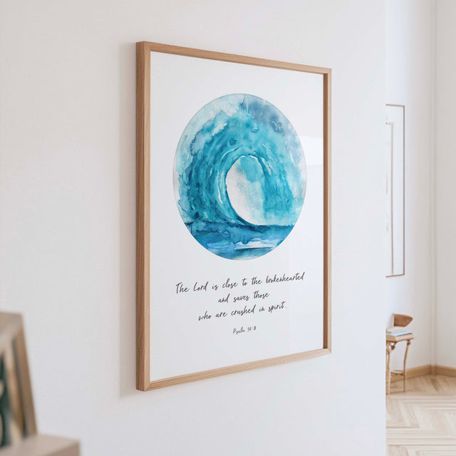 Christian wall art print featuring a soothing turquoise wave with the Bible verse “The Lord is close to the brokenhearted” from Psalm 34:18.