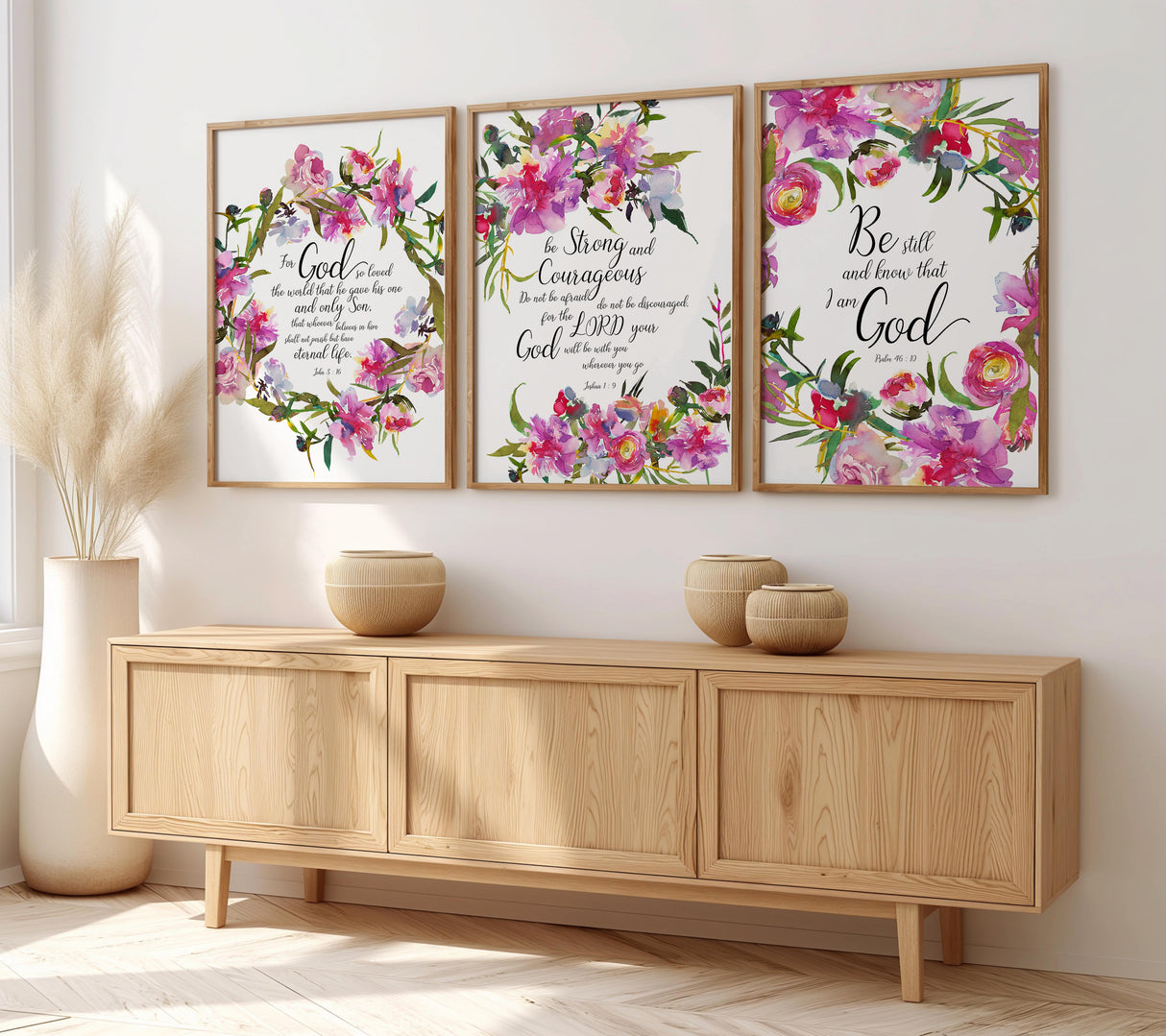 Christian Bible verse wall art triptych with delicate floral borders, featuring “Be still and know,” John 3:16, and Joshua 1:9.