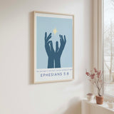 Ephesians 5:8 - Christian wall art print featuring hands reaching towards radiant light with Bible verse You are light in the Lord on soft blue background.