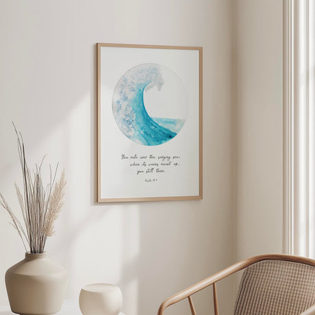 Turquoise ocean wave captured in a circular design with the Bible verse “You rule over the surging sea” from Psalm 89:9, creating a calm and reassuring Christian wall art print.