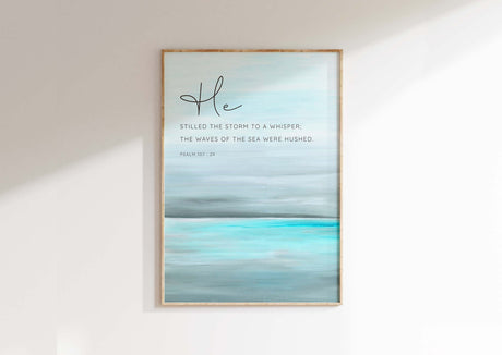 Psalm 107:29 - Bible quote art with abstract turquoise sea and He stilled the storm calm ocean scripture.