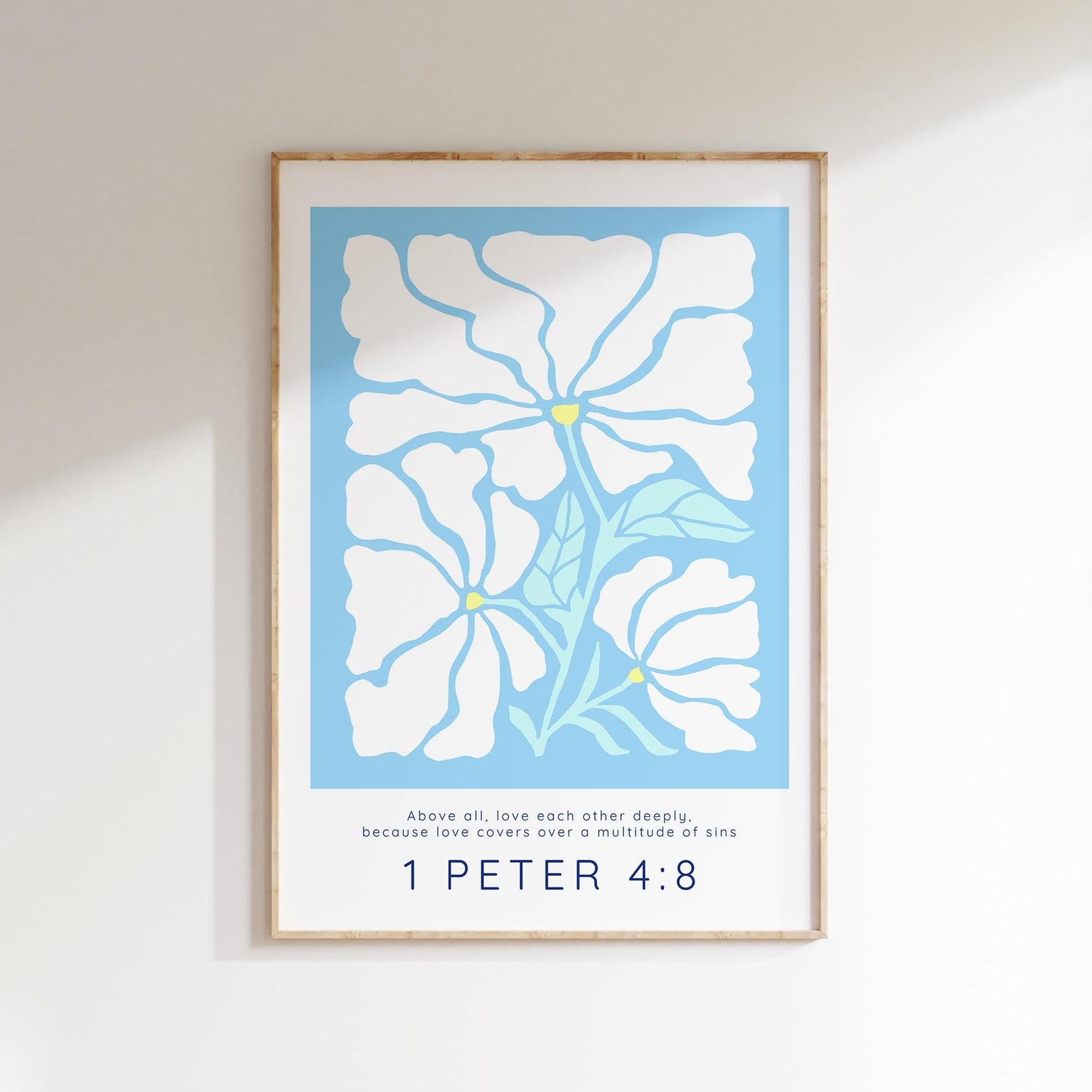 Elevate your space with a serene 1 Peter 4:8 print, featuring 'Above all, love each other deeply,' adorned with Matisse-style flowers on light blue