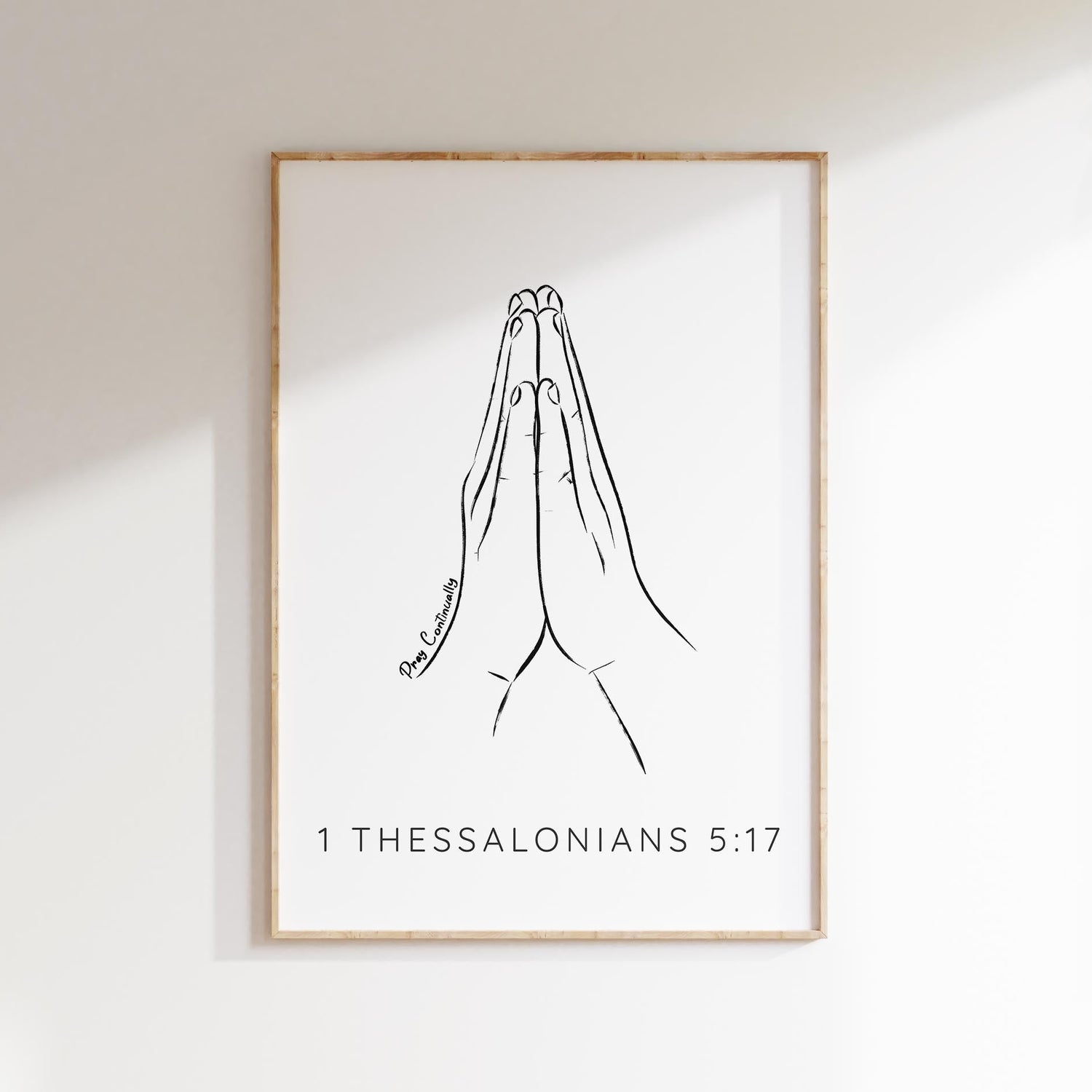 Grace your space with a minimalist 1 Thessalonians 5:17 print - praying hands and 'Pray Continually' quote, a symbol of faith.
